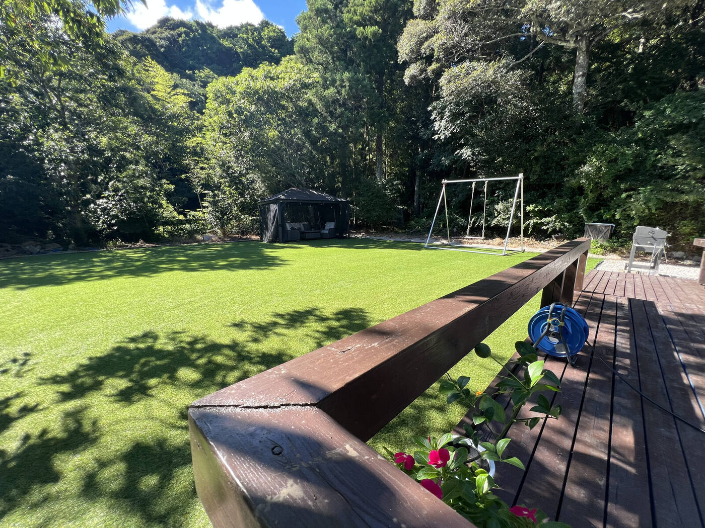 The lawn garden and gazebo seen from BlueFlow KATSUURA's wooden deck